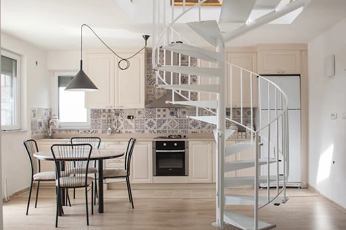 Skopje Apartment Project: Beige Kitchen Cabinets with Wood Floors