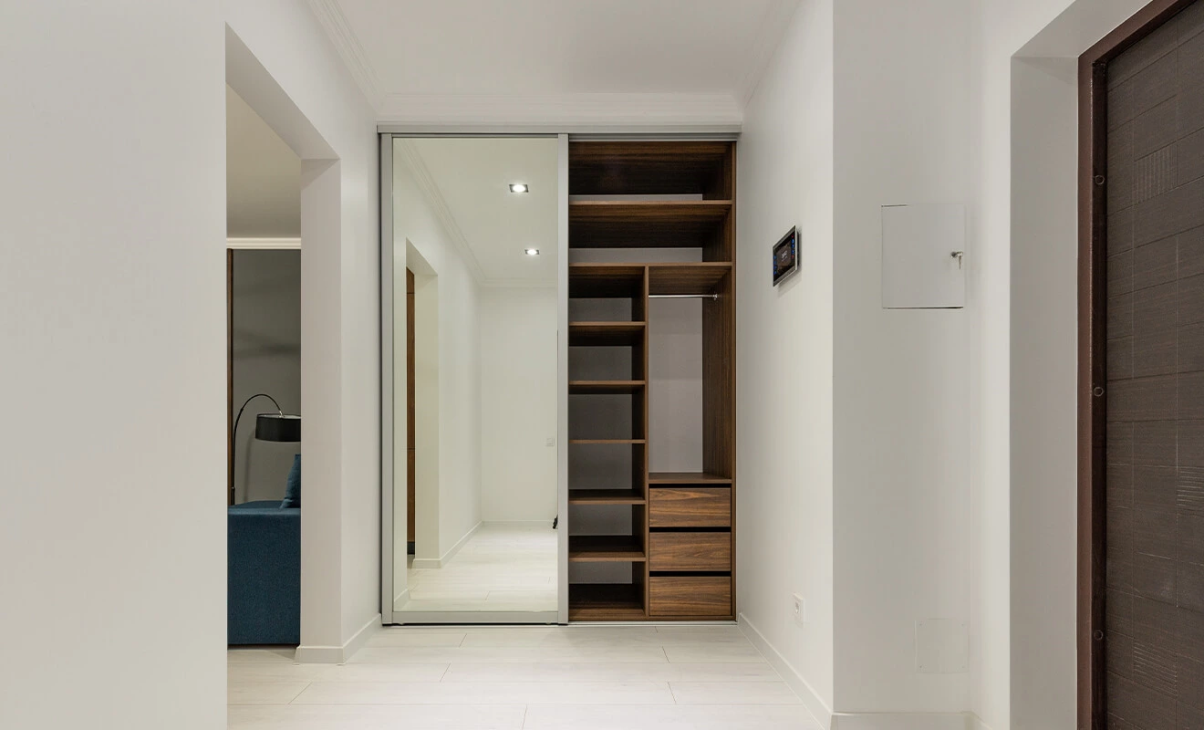 custom wardrobe storage solution with shelves drawers and hanging rails