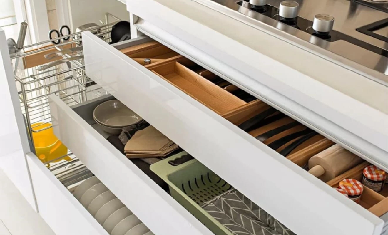 High-low kitchen countertop design for sink and cooking zone