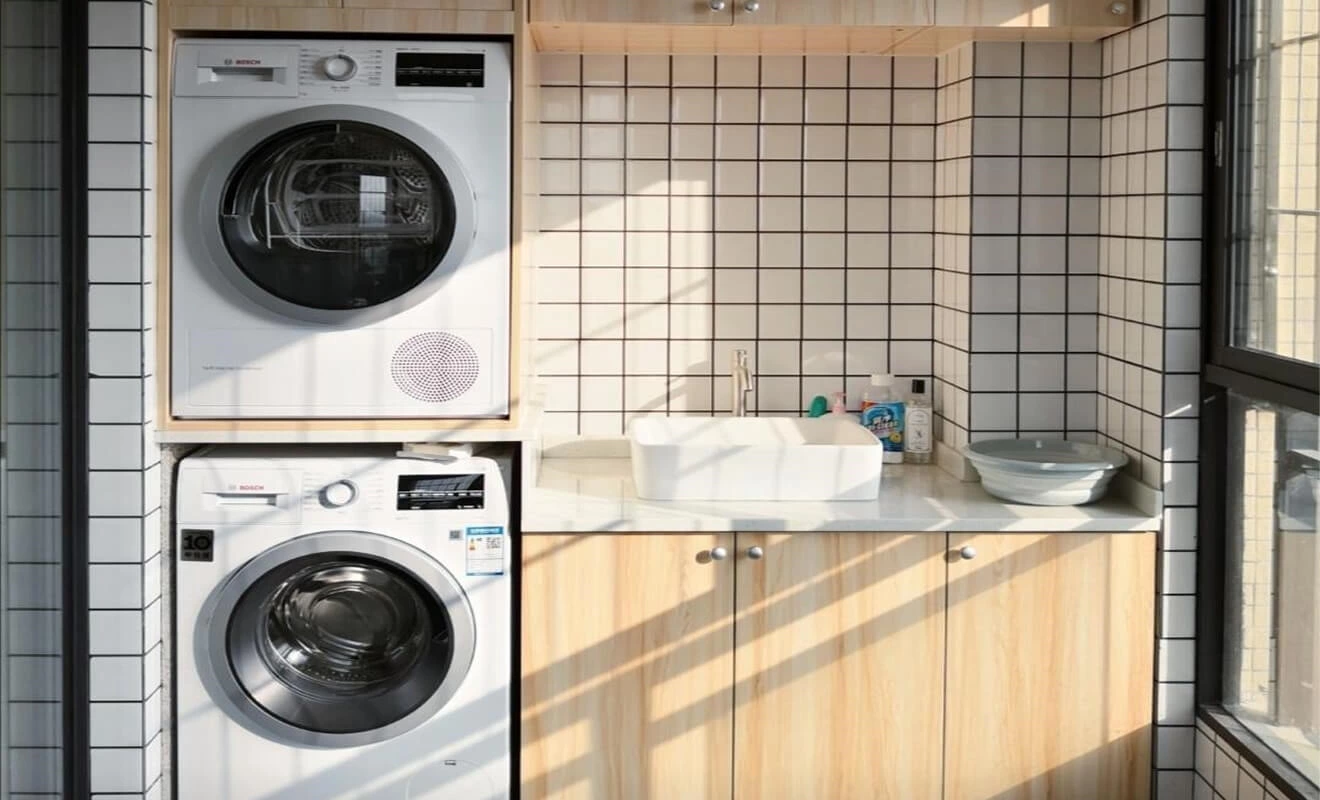 Balcony laundry cabinet with washing machine storage system