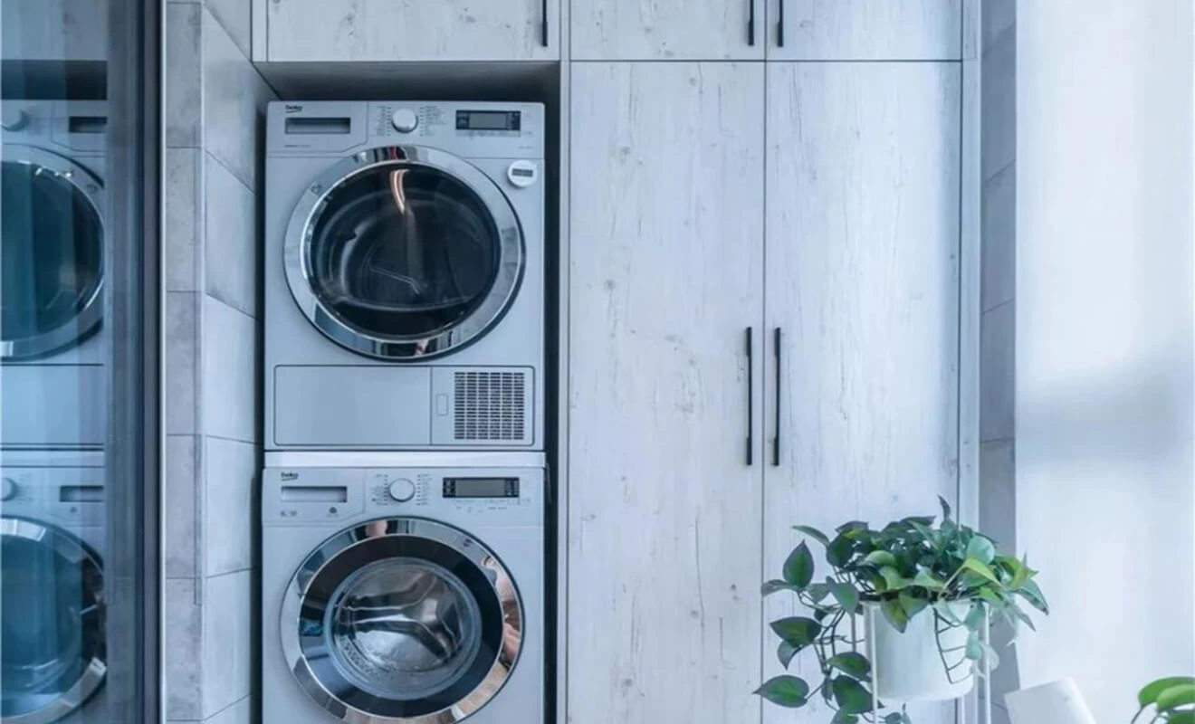 Built-in balcony cabinet for laundry workflow and storage