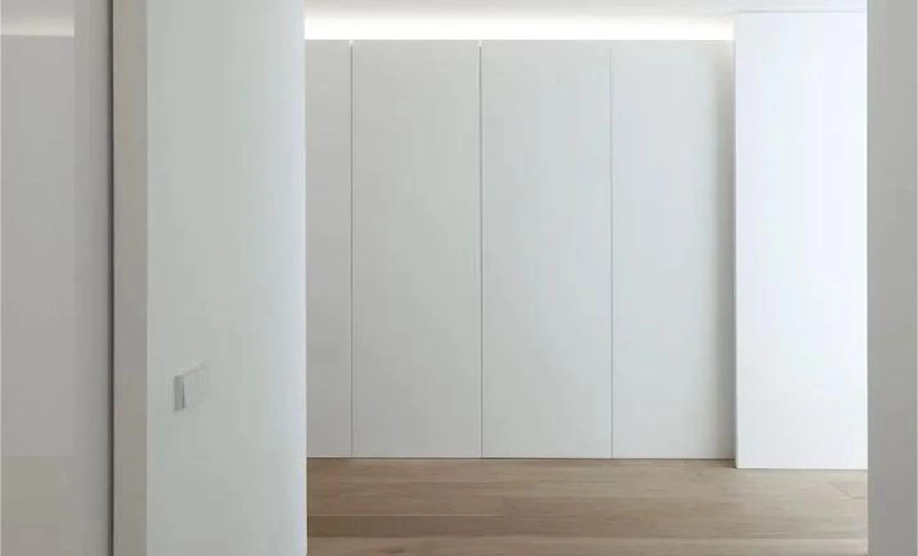 Invisible door handle designs in a seamless modern interior Invisible door handle designs in a seamless modern interior