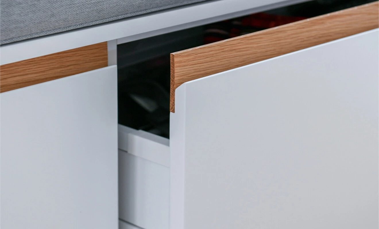 Hidden slot handle used on a built-in storage cabinet Hidden slot handle used on a built-in storage cabinet