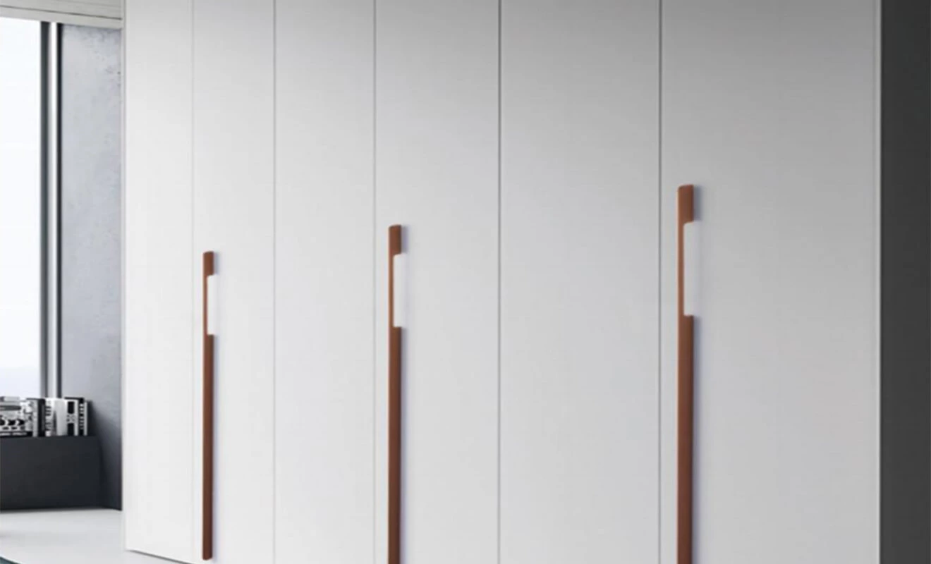 Floor-to-ceiling cabinet doors with elongated handles Floor-to-ceiling cabinet doors with elongated handles