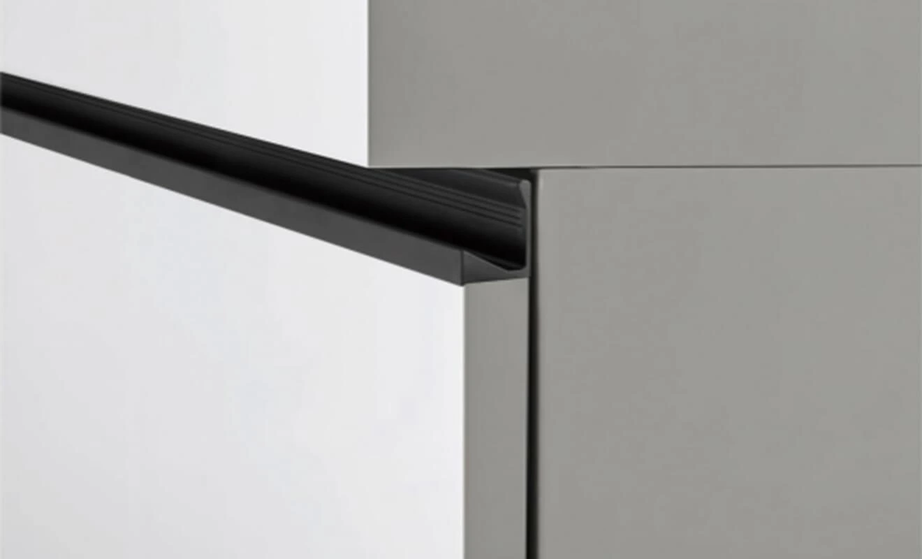 Invisible cabinet edge handle for a seamless cabinet front Invisible cabinet edge handle for a seamless cabinet front