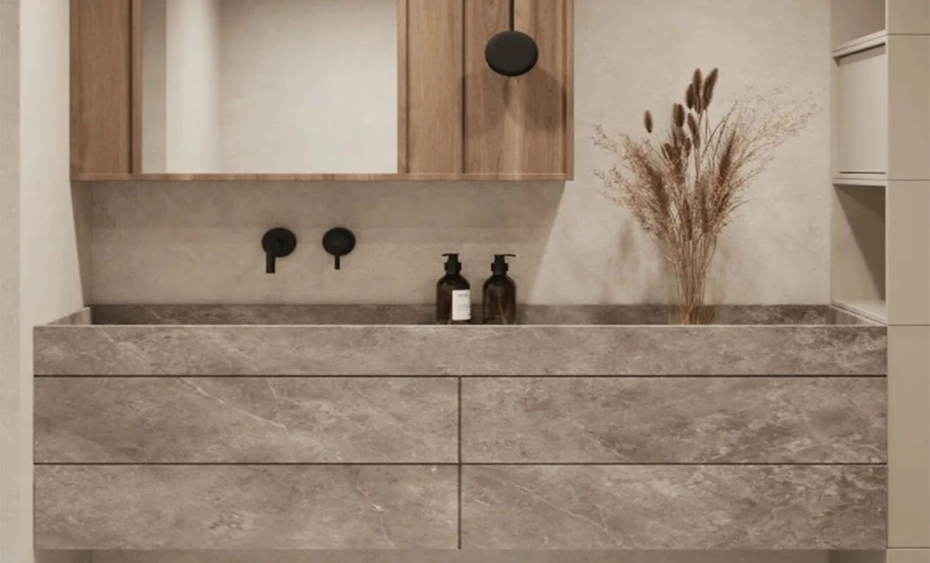 Moisture-resistant bathroom cabinet with protected countertop edge