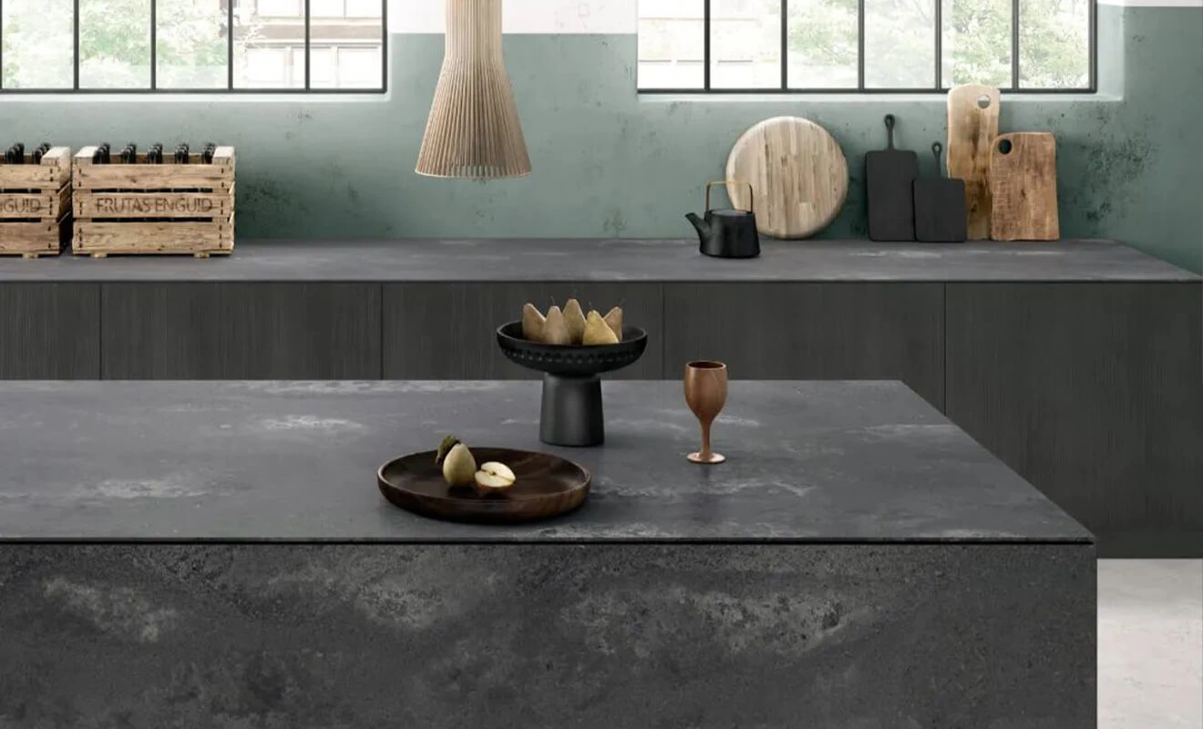 Dark stone countertop paired with contemporary kitchen cabinets
