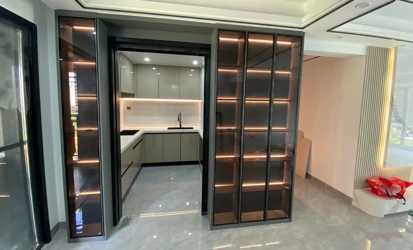 Glass door side cabinet providing storage and display at the kitchen entry Glass door side cabinet providing storage and display at the kitchen entry