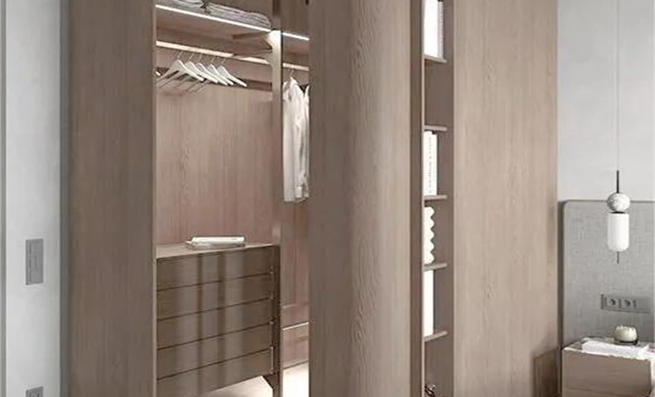 Wardrobe partition creating storage in a rectangular bedroom Wardrobe partition creating storage in a rectangular bedroom