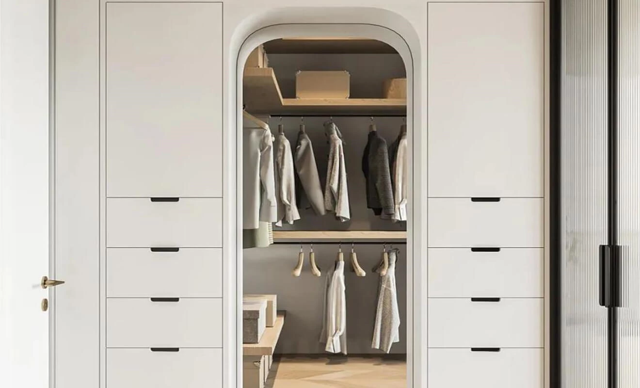 Walk-in closet storage alcove with curved custom cabinet design Walk-in closet storage alcove with curved custom cabinet design