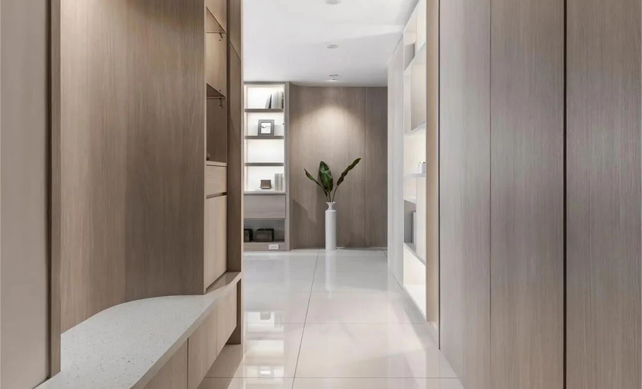 Hallway cabinet with integrated seating and curved entry storage Hallway cabinet with integrated seating and curved entry storage