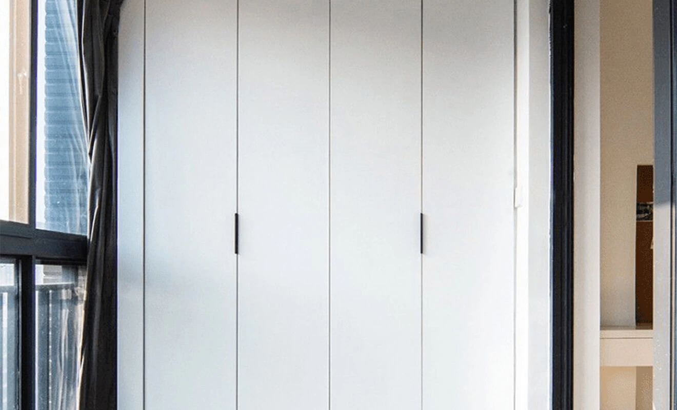 L-Shaped Full Height Wardrobe L-shaped full height wardrobe with LED lighting and pink cabinet doors