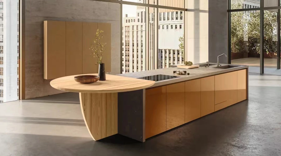 Warm Wood Kitchen Island Cabinetry with Sintered Stone Cooktop