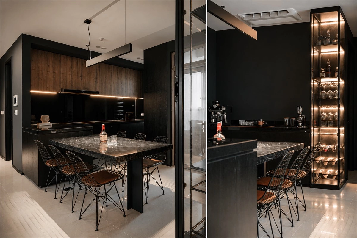 Black and wood kitchen cabinets in a compact L-shaped kitchen with dining table and glass wine cabinet