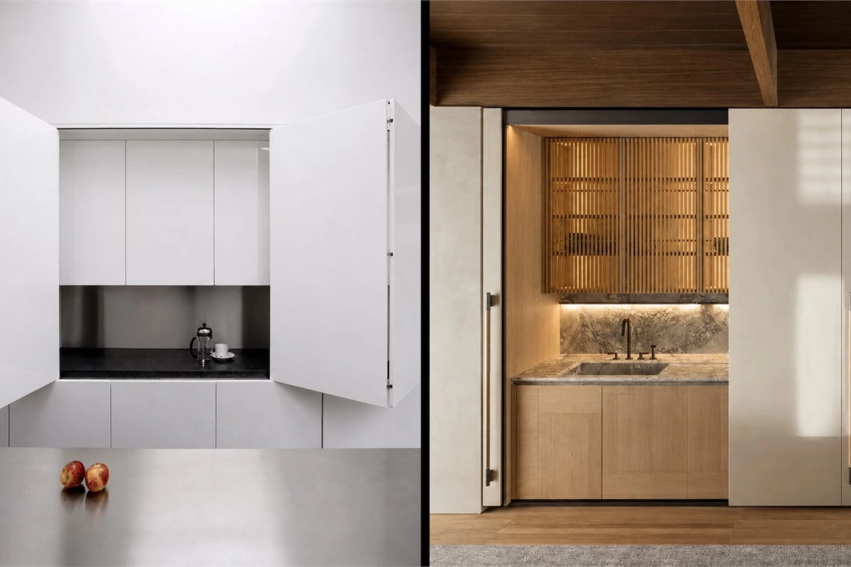 Cabinet pocket doors concealing a modern hidden kitchen work zone