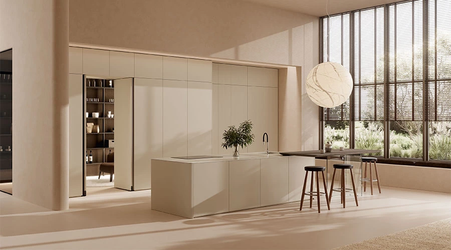 Cream open kitchen with curved island and walnut breakfast bar