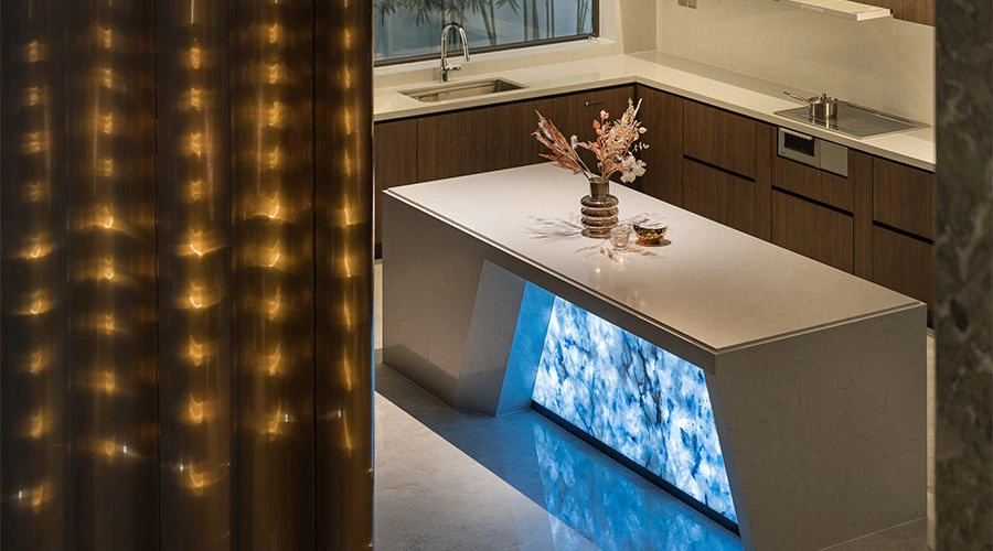 Illuminated stone kitchen with glowing natural stone island