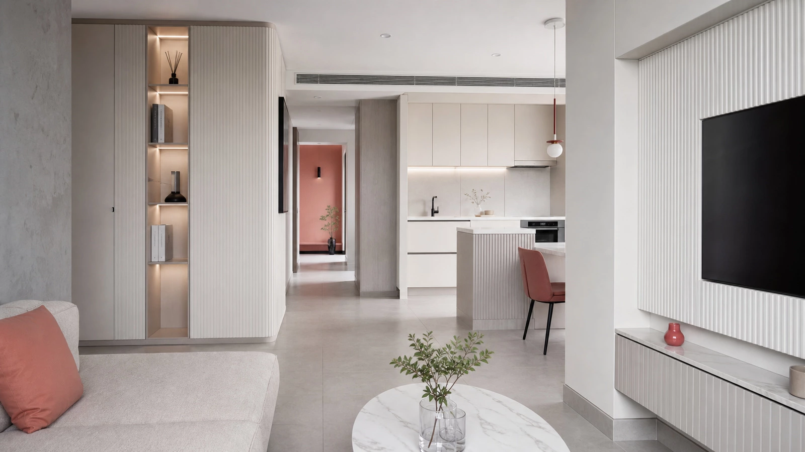 L-shaped kitchen cabinetry in a muted white Ho Chi Minh City apartment