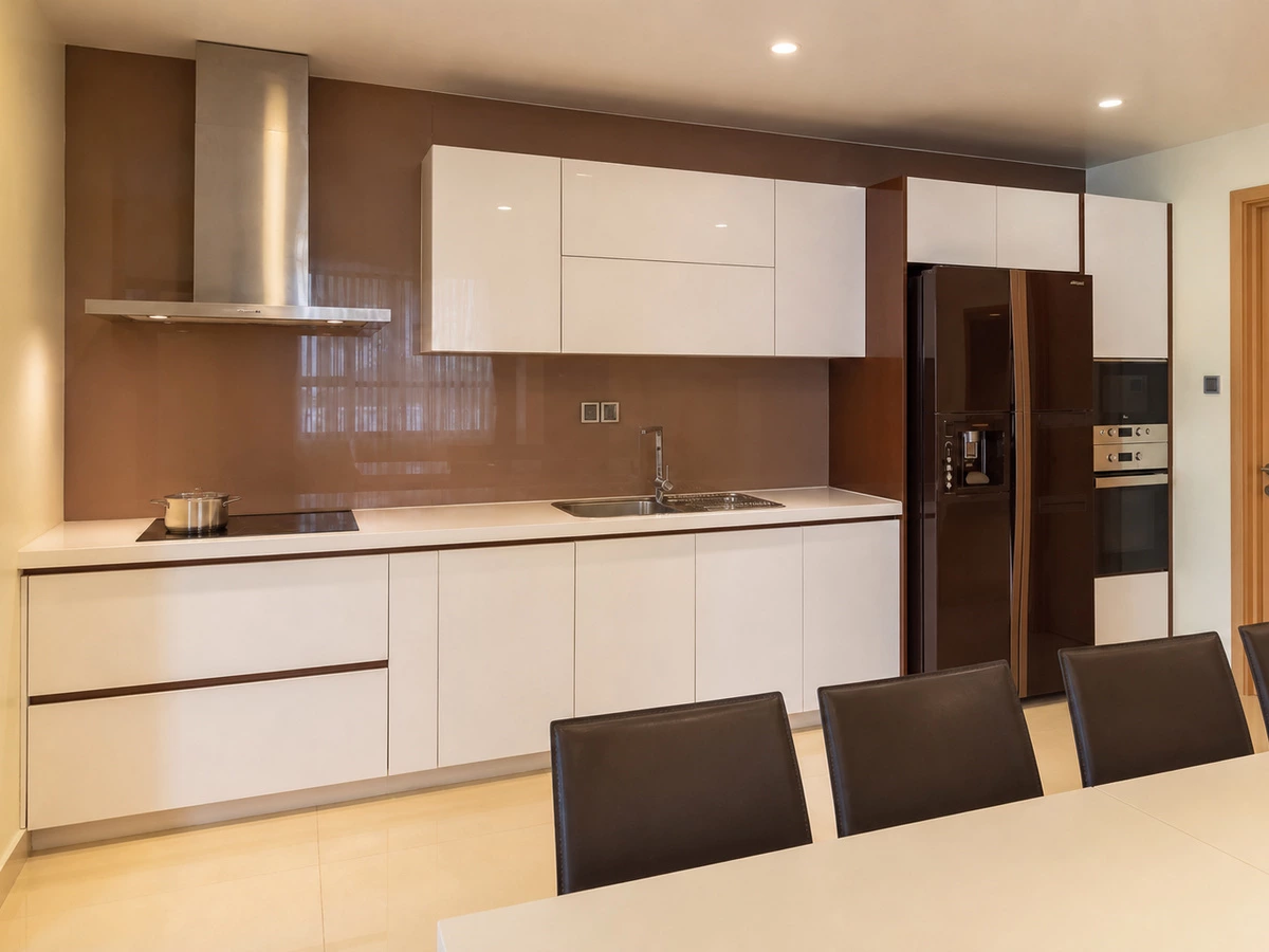 Wide kitchen view with white lacquer kitchen cabinets in a Ho Chi Minh apartment