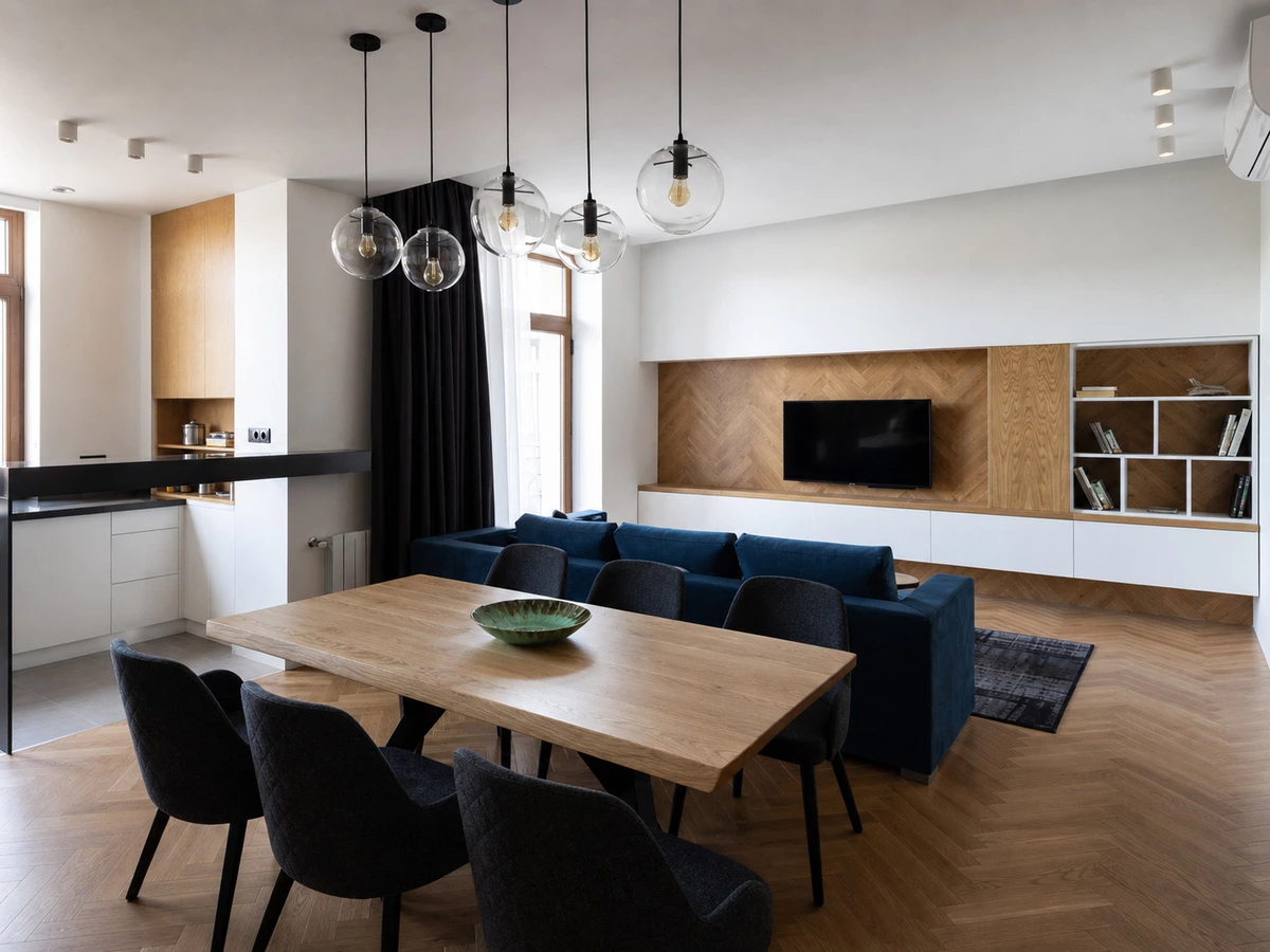 Crisp white cabinetry and varied wood textures in a Singapore living area