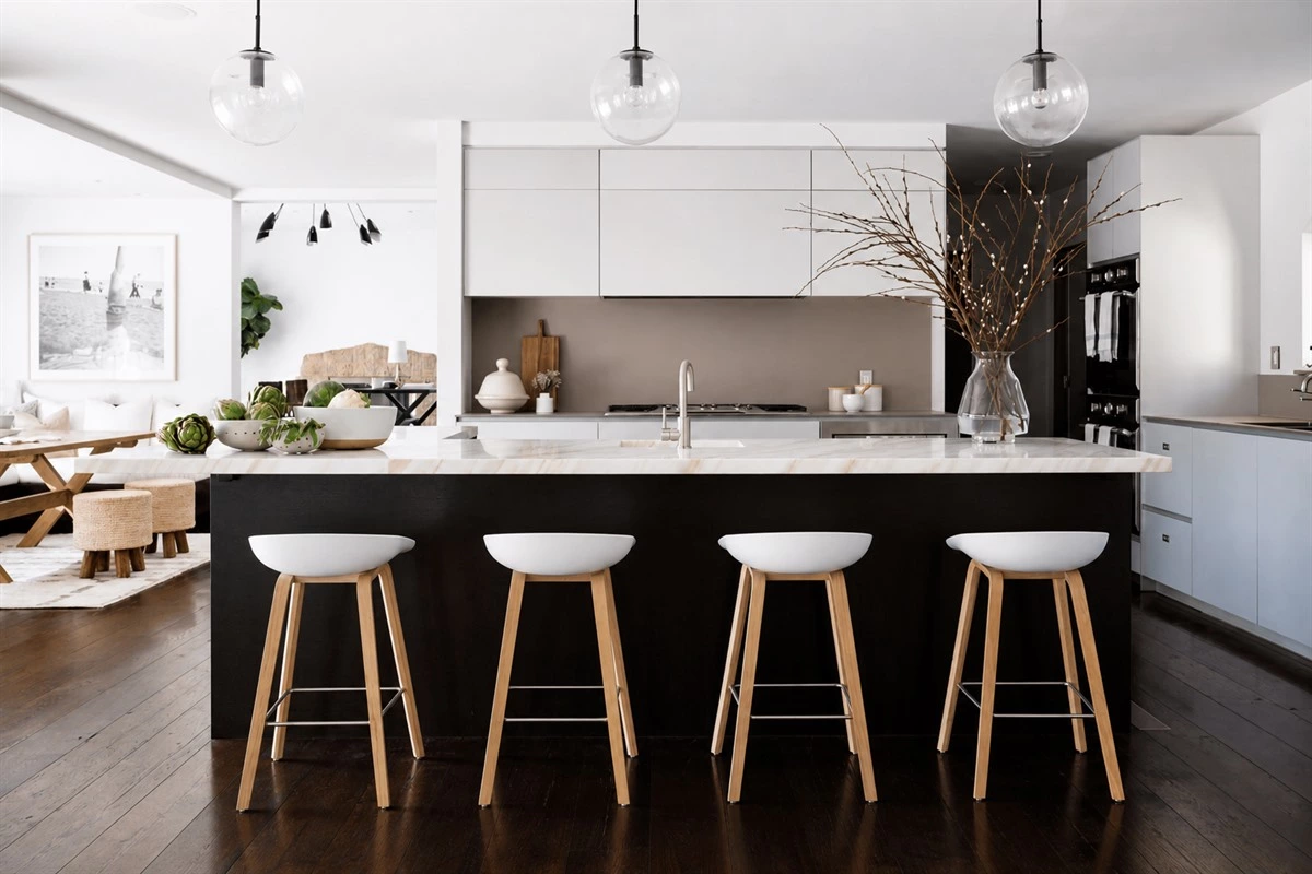 Zen minimalist kitchen with light wood cabinets and soft white finishes