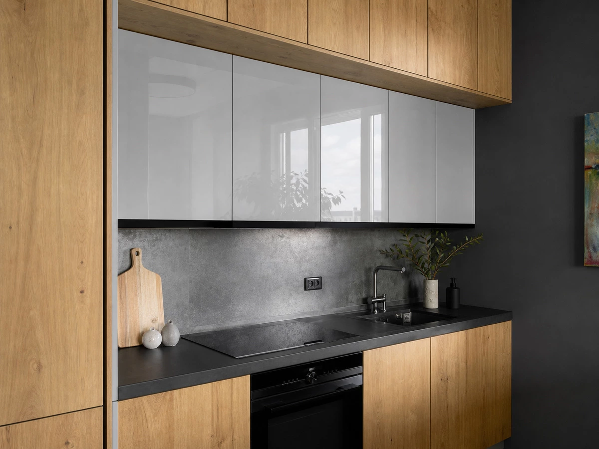 Luminous grey gloss wall cabinets paired with natural oak kitchen finishes