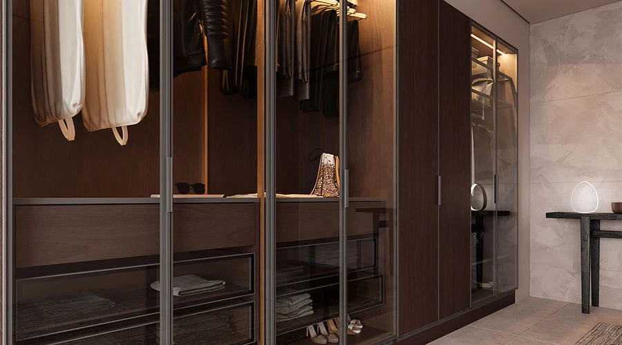 High-end wardrobe system with walnut veneer and semi-transparent glass doors