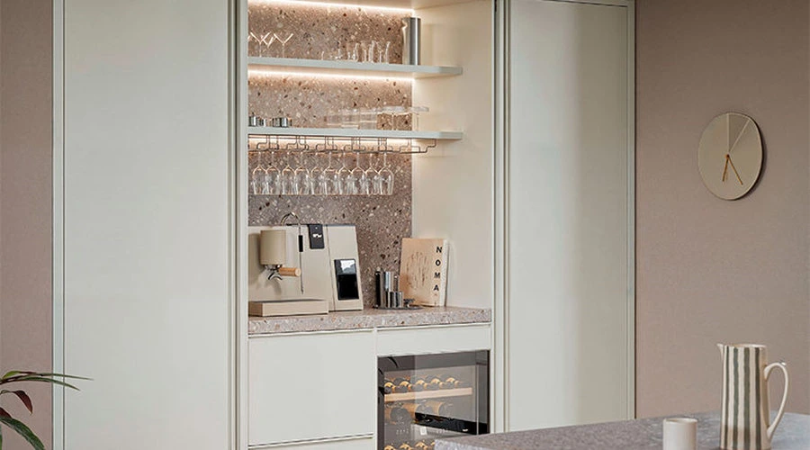 Hidden mini bar behind pocket doors in an Italian minimalist kitchen