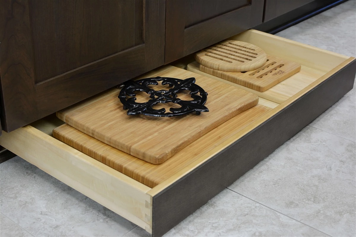 Kitchen toe-kick drawer for baking trays and hidden storage