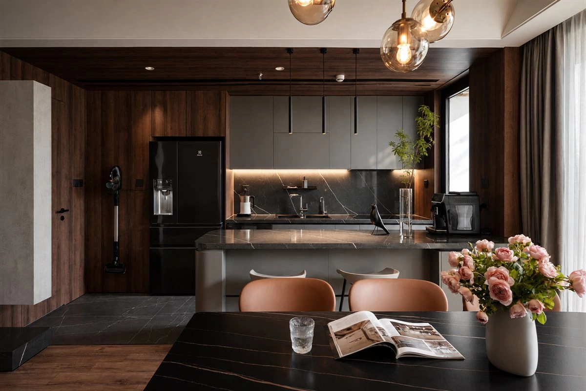 Neutral wood and stone kitchen with island storage
