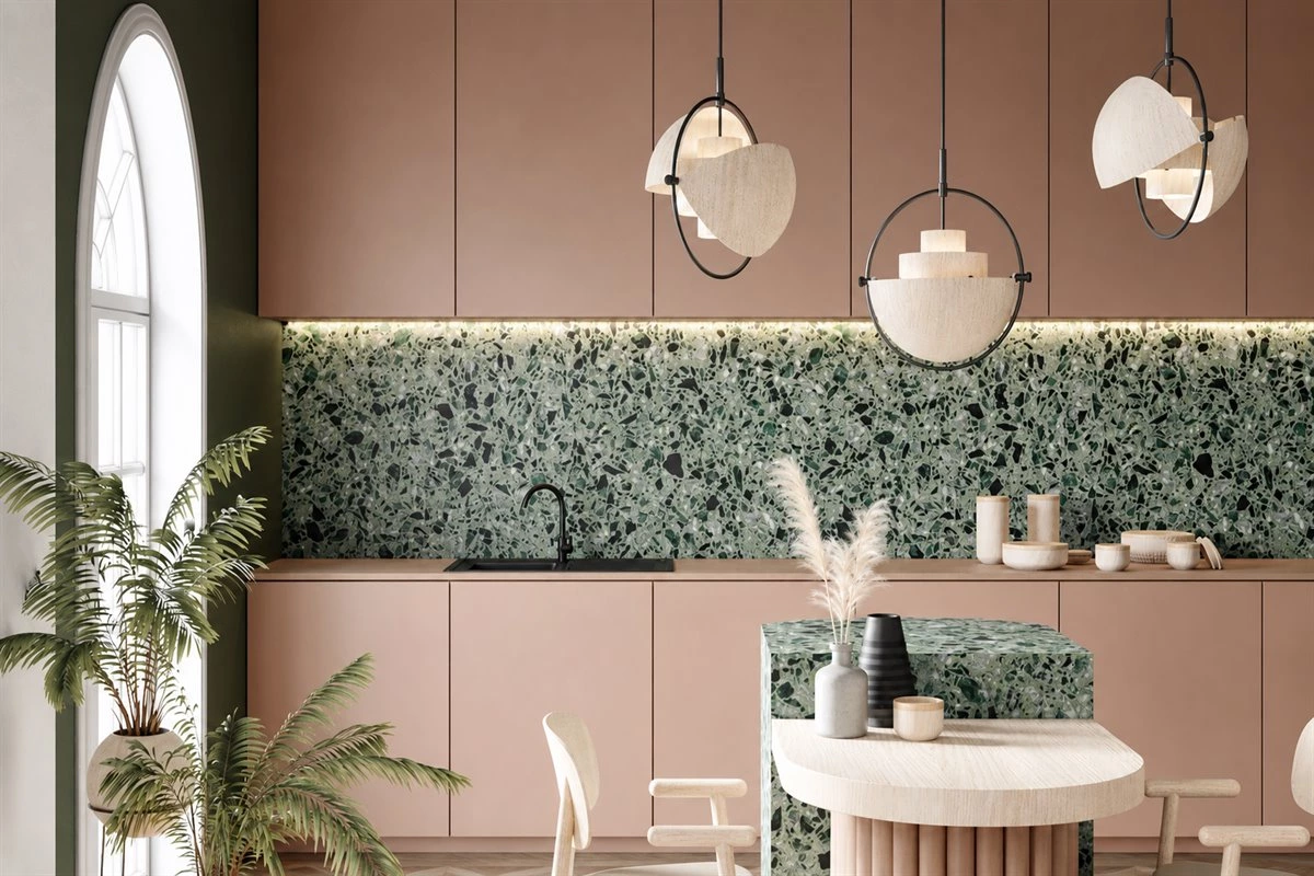 Rose pink handleless kitchen cabinets with green backsplash and island