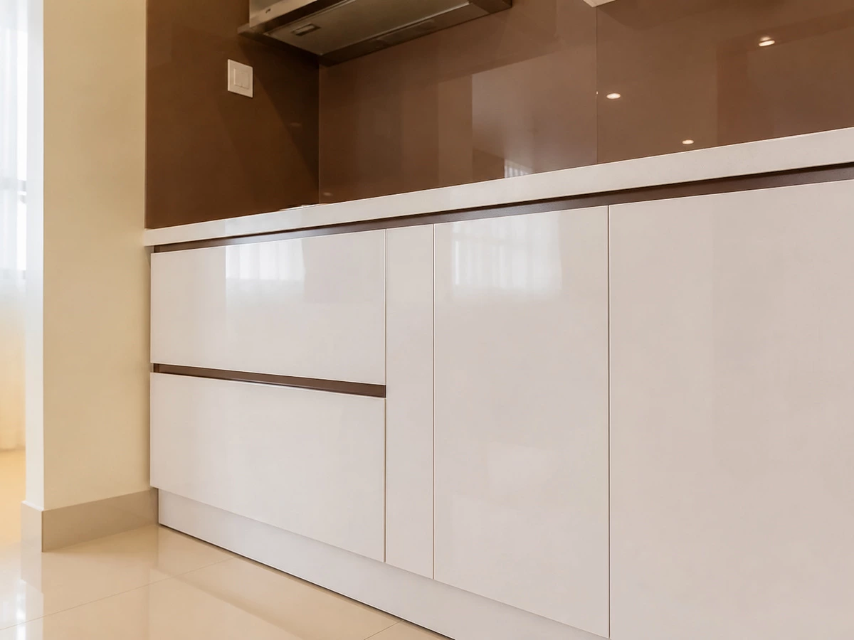 Gloss door detail on white lacquer kitchen cabinets in the Ho Chi Minh apartment