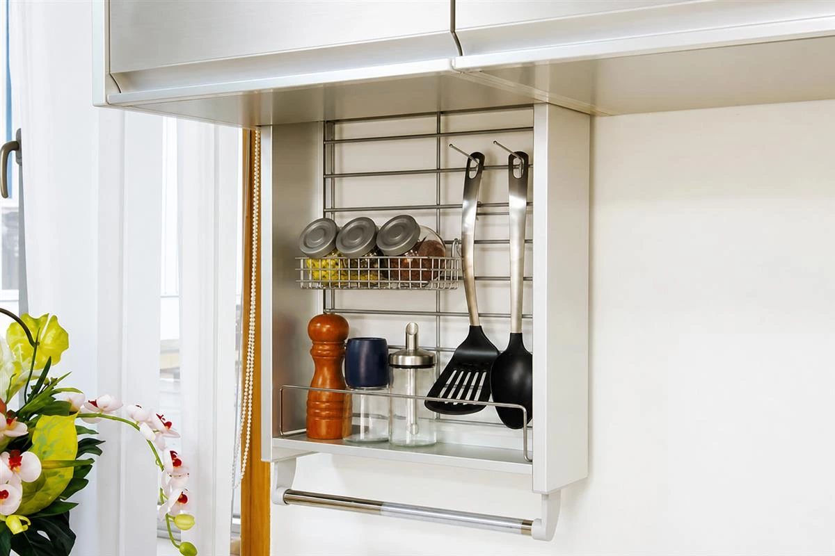 Organized spice storage inside a custom kitchen cabinet