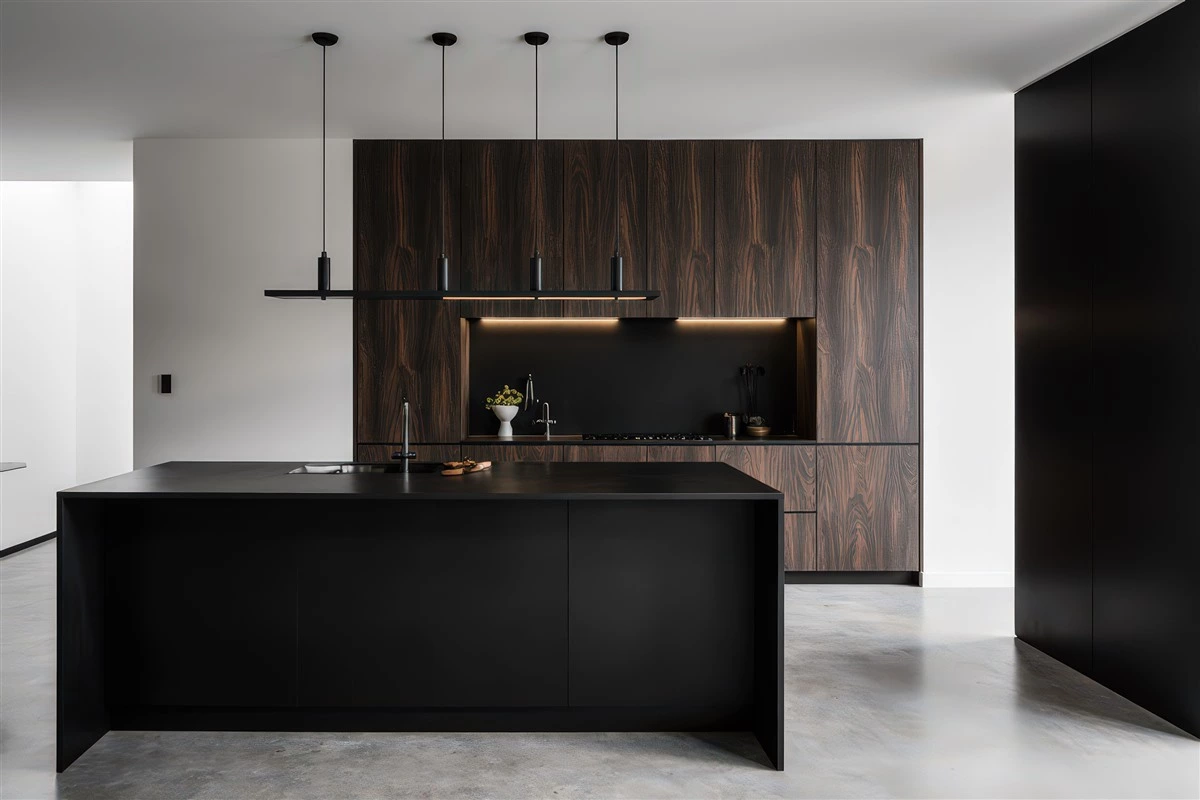 Dark kitchen with timber backsplash and concealed lighting