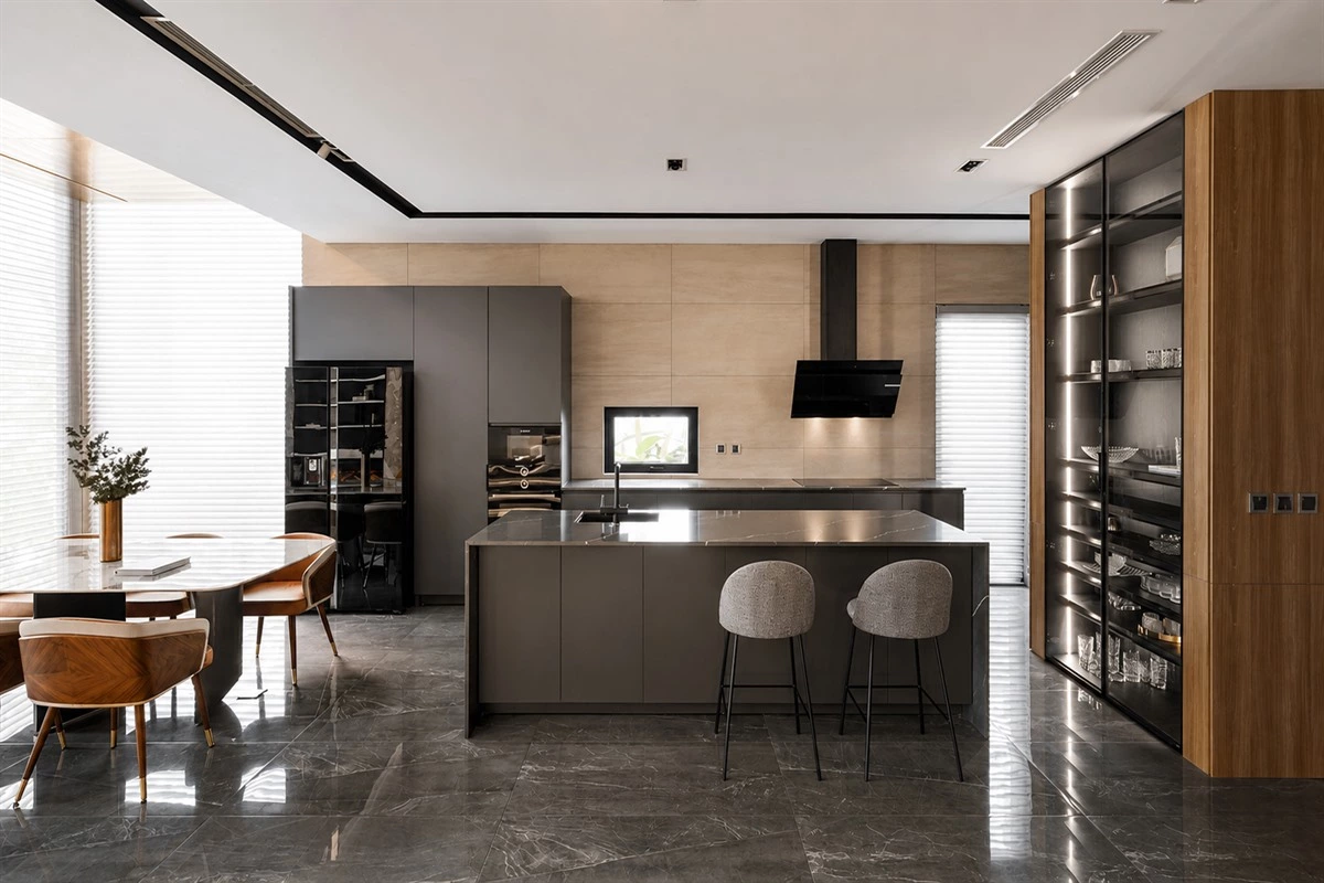 Flat-panel grey cabinets in a refined apartment kitchen
