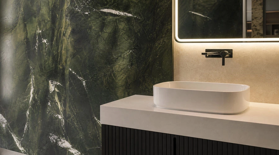 Luxury green stone feature wall and black fluted floating vanity detail