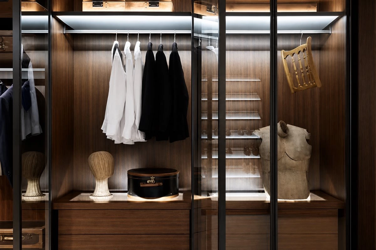 Walk-in closet LED lighting design with illuminated wardrobe storage