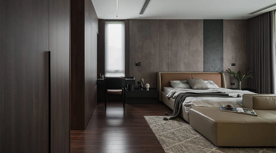 Walnut master bedroom with floor-to-ceiling windows and soft neutral bed area
