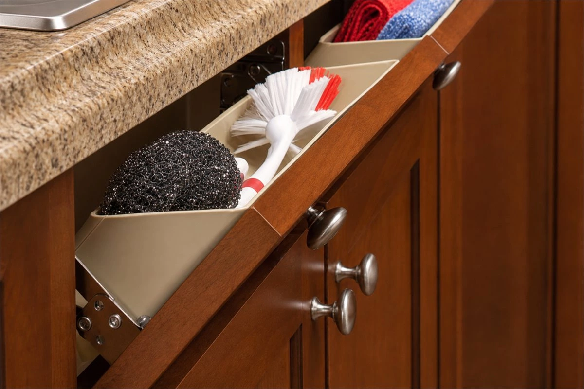 Kitchen cleaning utensil storage in a slim pull-out base cabinet