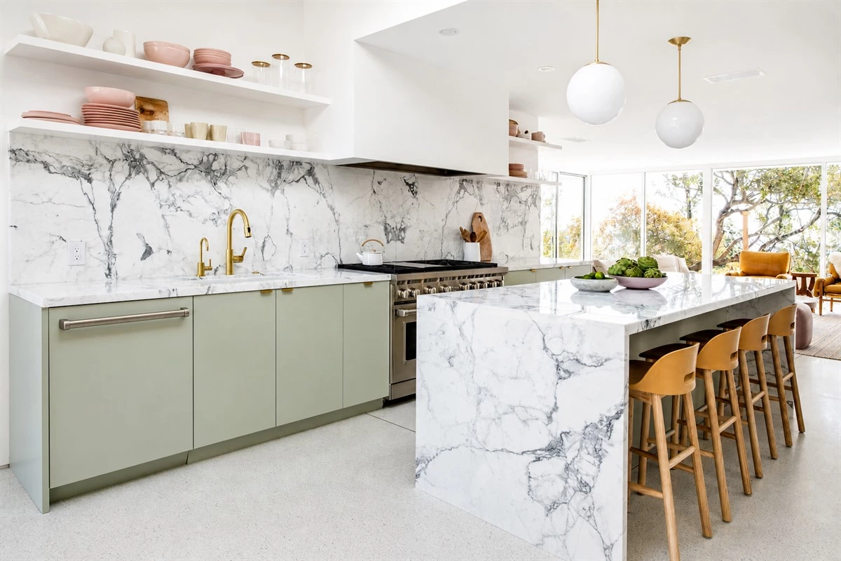Mid-century minimalist kitchen with waterfall marble island