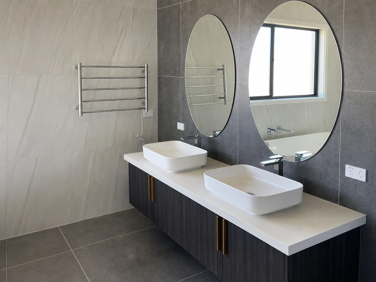 Bathroom vanity coordinated with white kitchen units in a Spain villa