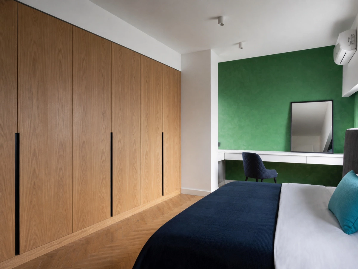 Wood-finish wardrobe coordinated with white cabinetry