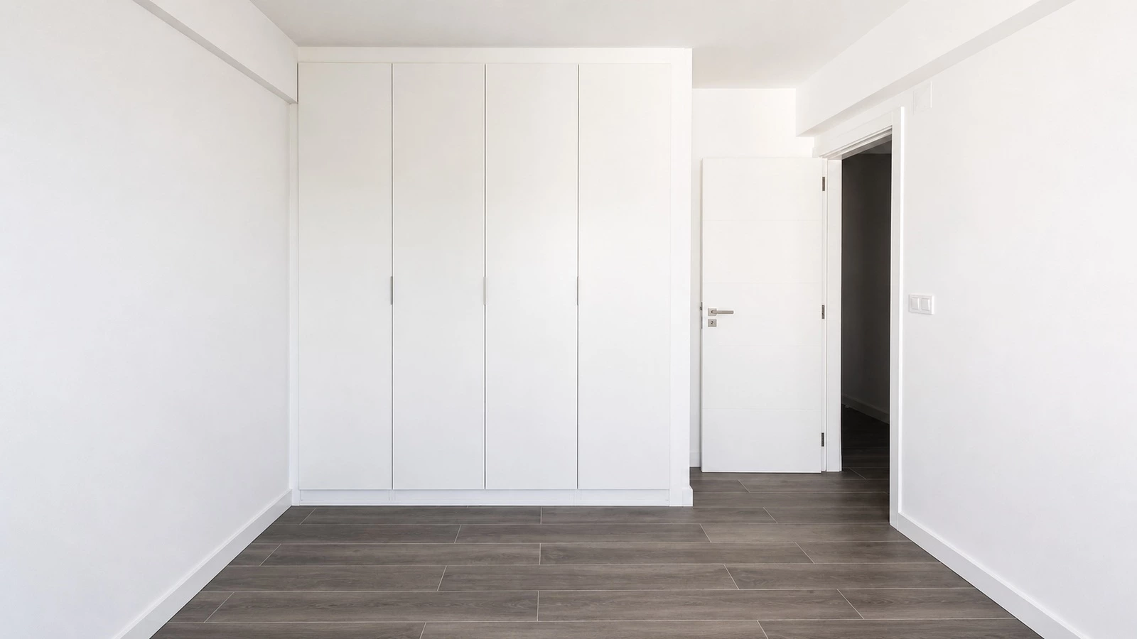 All-white wardrobe in the AC1 Sintra minimalist apartment