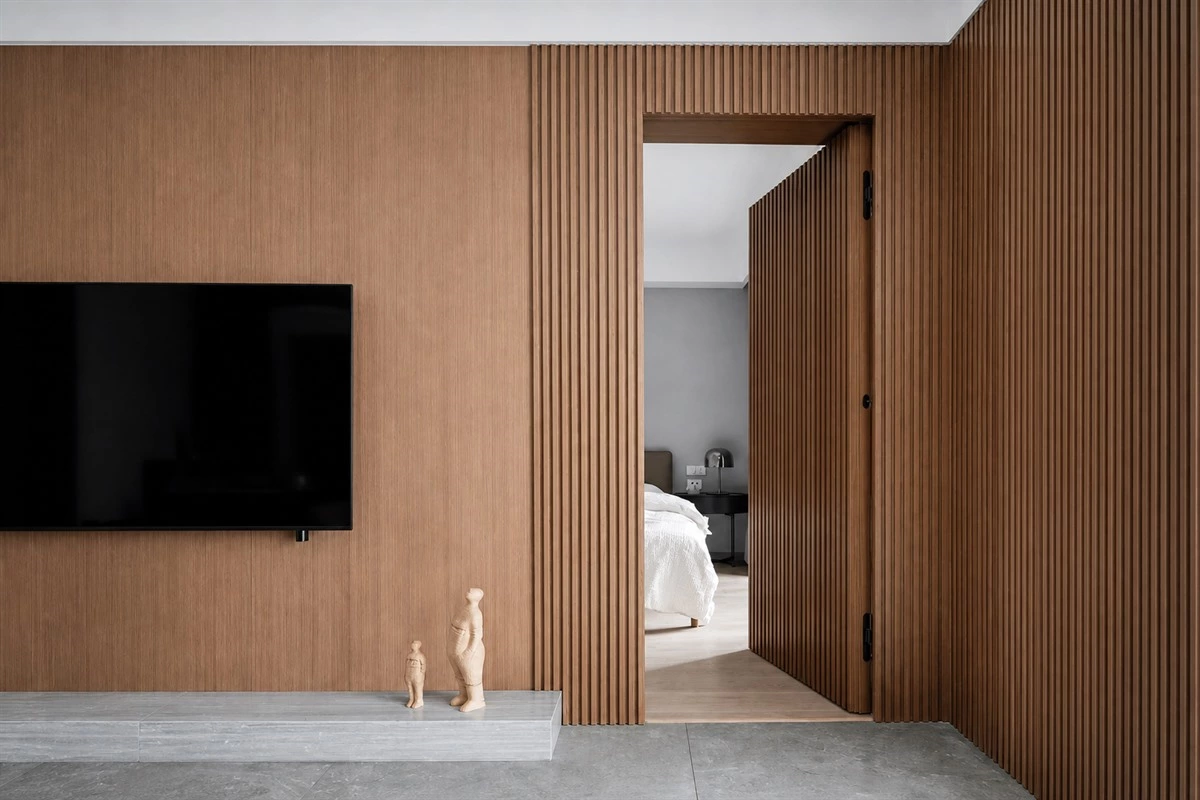 Wall paneling integrated with a hidden interior door