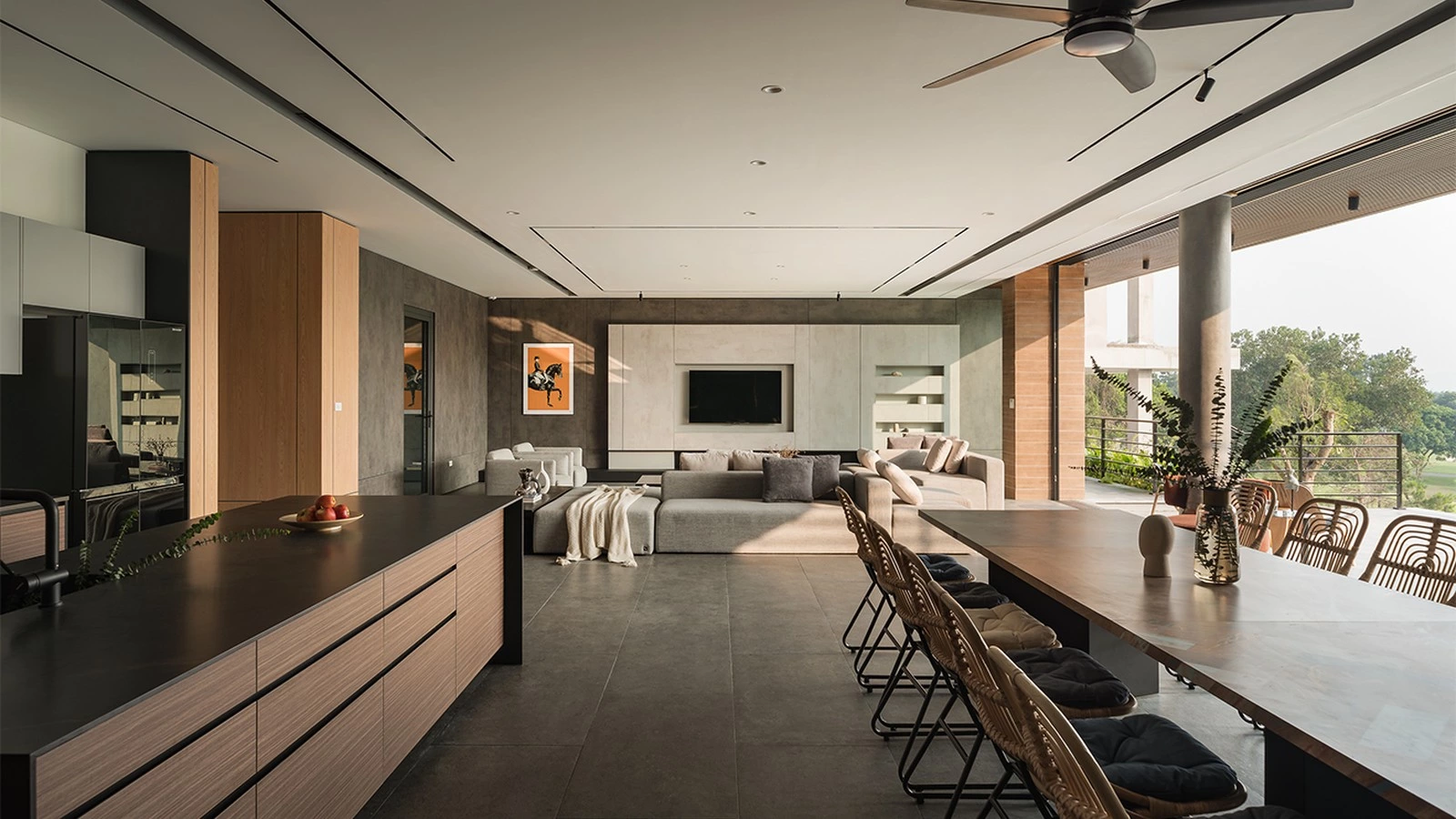 Open plan kitchen cabinetry with wood-grain island and dining connection