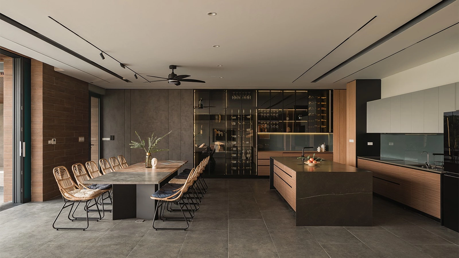 Layered kitchen wall cabinets with blue glass backsplash