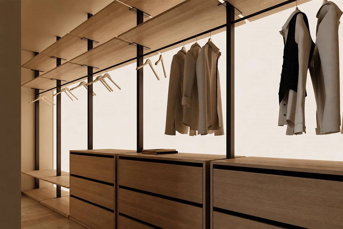 Matching slim hangers in an organized walk in closet