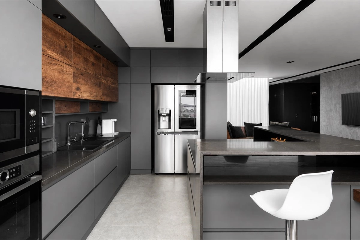 Minimalist kitchen layout with built-in appliances integrated cabinet fronts and efficient work zones