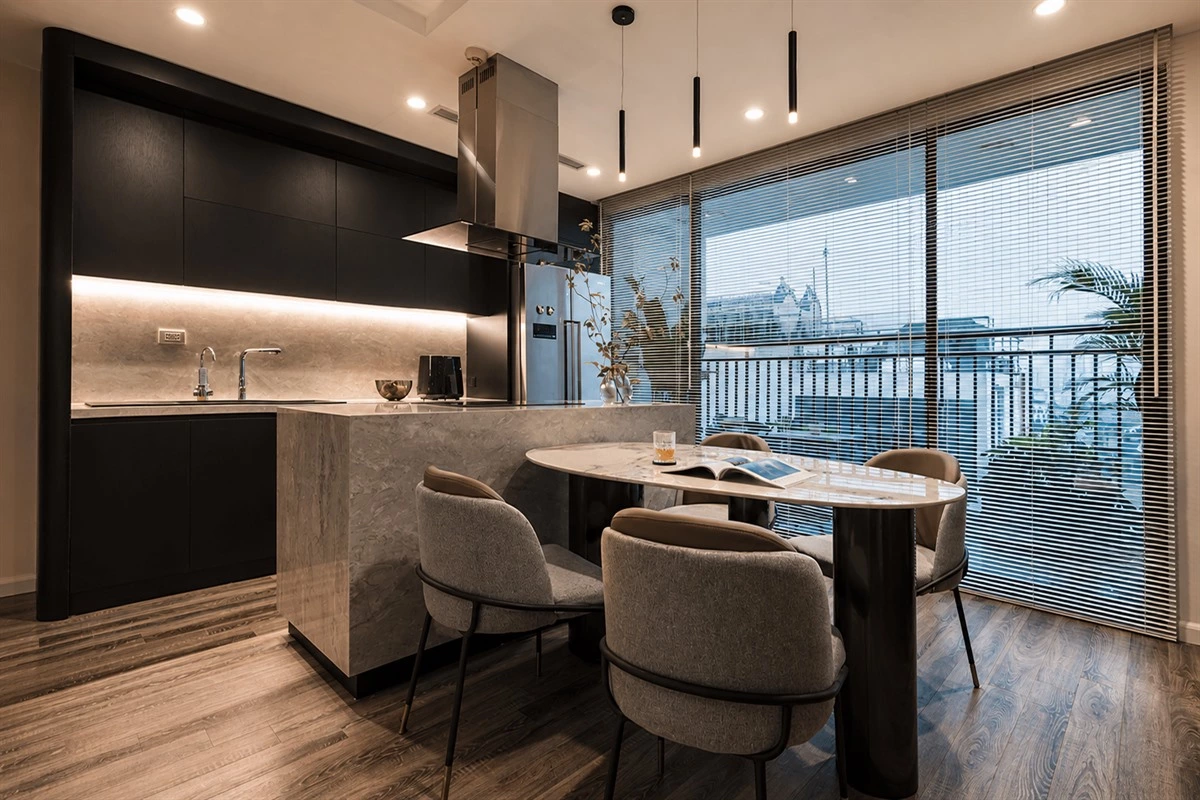 Quartz island and double-tier wall cabinets in a modern kitchen