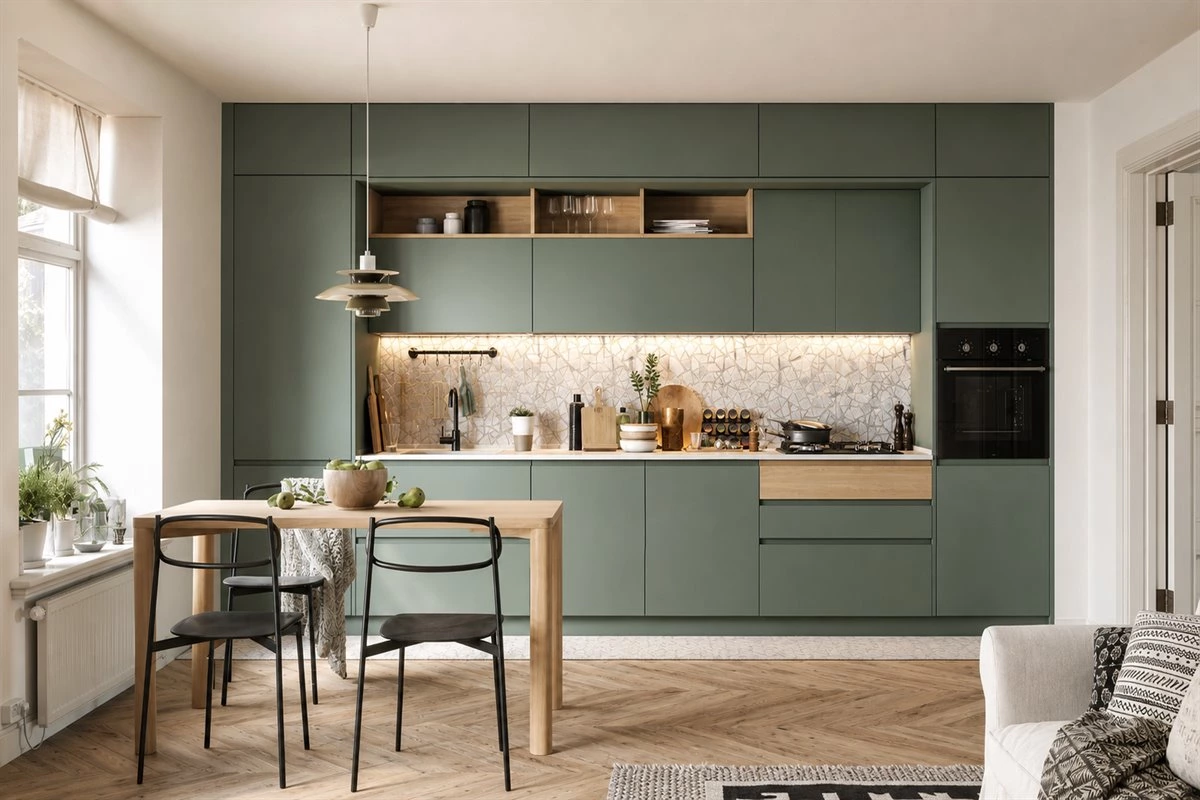 Sage green handleless kitchen cabinets with light wood finishes